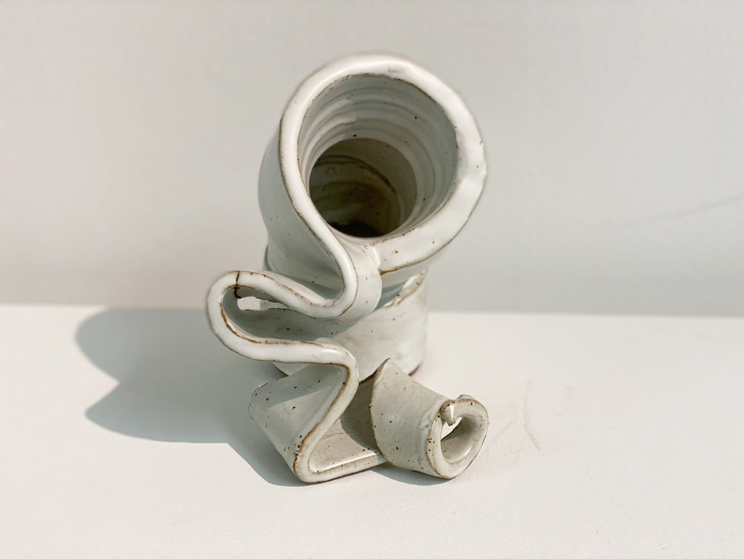 white ceramic cylinder unraveling